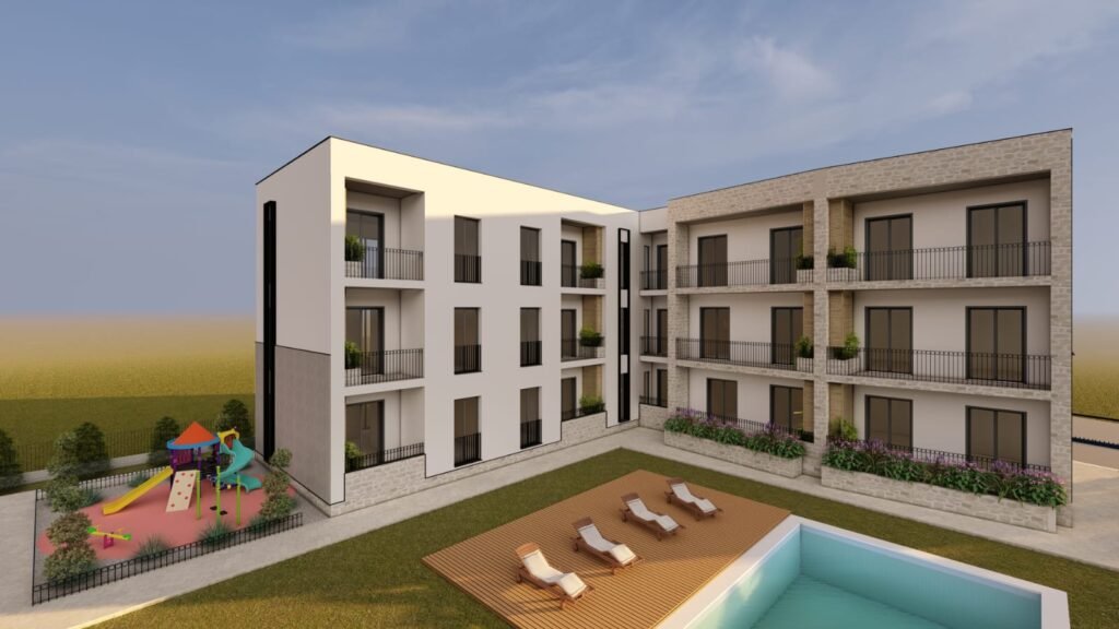 Modern apartment building with pool and playground.| Rochefort's INTERNATIONAL REALTY